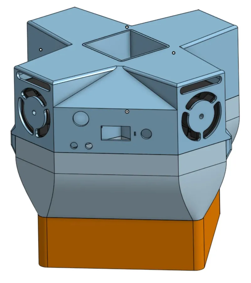 CAD render of the closed cross-shaped housing with fan grilles and a control panel.